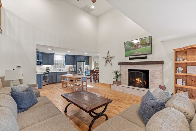 Living Room Features a Beautiful Remodeled Woodburning Fireplace and Opens to the Kitchen! | Image 8