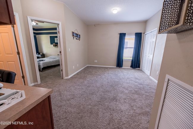 11760 Huckleberry Trl E, House other with 4 bedrooms, 2 bathrooms and null parking in MACCLENNY FL | Image 24