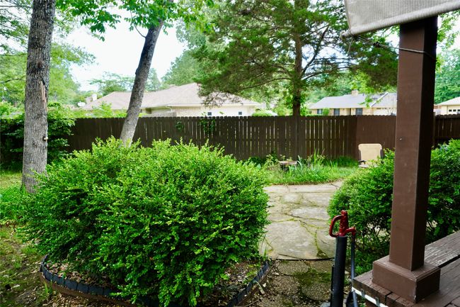 View of yard featuring a patio and a fenced backyard | Image 23