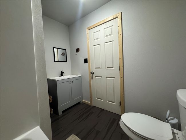 Bathroom with vanity and wood finished floors | Image 14