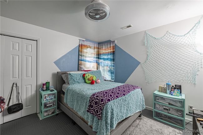 Carpeted bedroom with a closet | Image 13