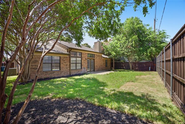 Fenced backyard featuring a patio | Image 22