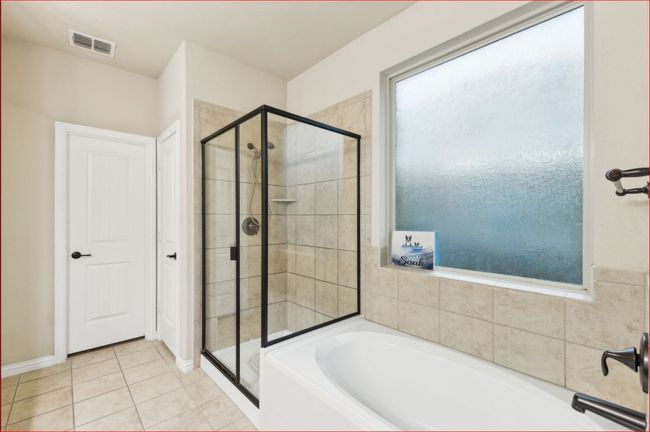 Full bathroom featuring a garden tub, a shower stall, and tile patterned floors | Image 19