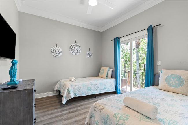 Bedroom #3 w/ impact sliding door to open porch | Image 29