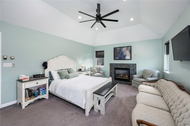 Bedroom featuring ceiling fan | Image 16
