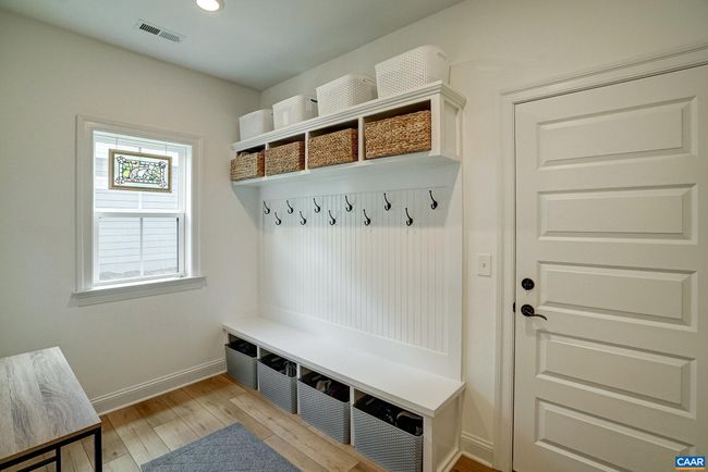 Large mudroom features built in bench with cubbies. | Image 27