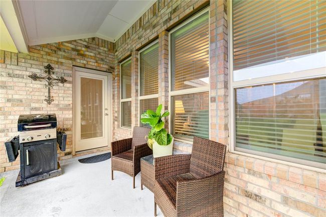 Peaceful covered back patio | Image 34