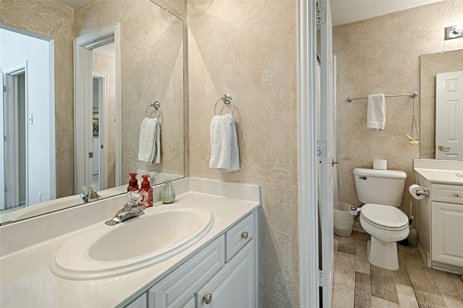 Bathroom featuring vanity and toilet | Image 10