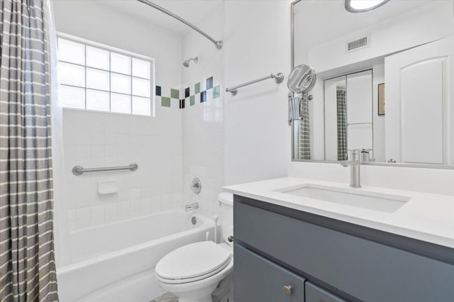 Full bath featuring shower / bath combo with shower curtain and vanity | Image 16