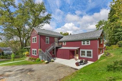 Side View With Patio Area And Parking Area | Image 1