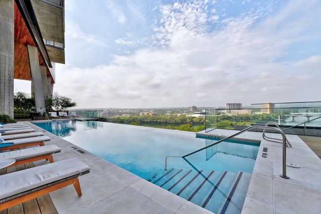 Pool with a patio area | Image 17
