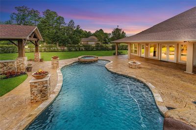 The pergola, saltwater pool and hot tub create the perfect backyard oasis | Image 3