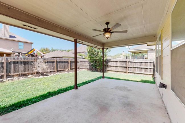 View of patio / terrace featuring a fenced backyard and ceiling fan and is plumbed for natural gas. Hook up the gril and your set ! This is a larger than normal covered patio. | Image 32