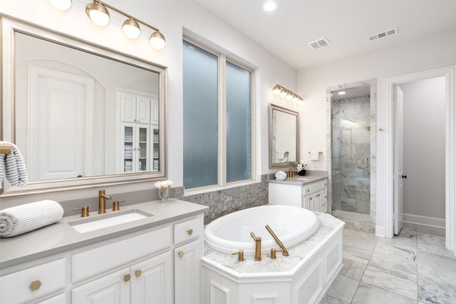 Glass walk in shower, fogged windows, framed vanity mirrors really add to the elegance of this spa like retreat. Perfect way to wind down and start each day. | Image 21