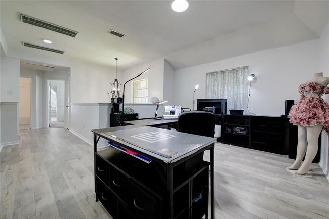 Off of the master bedroom is your game room with even more living options for a potential office/study or media room. | Image 18