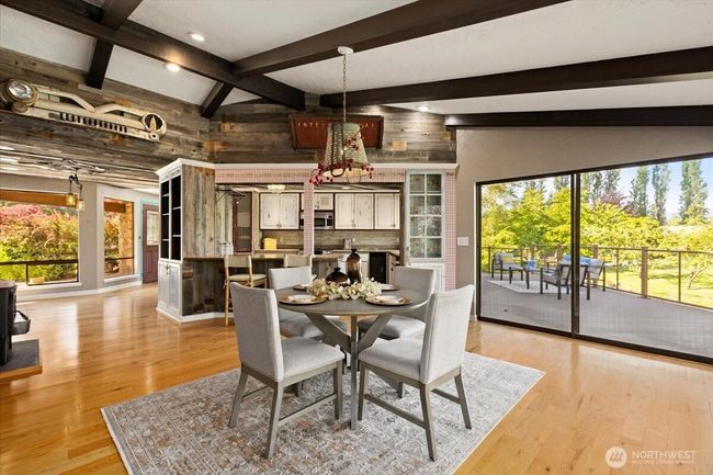 This charming dining area offers the perfect blend of comfort and sophistication. | Image 16
