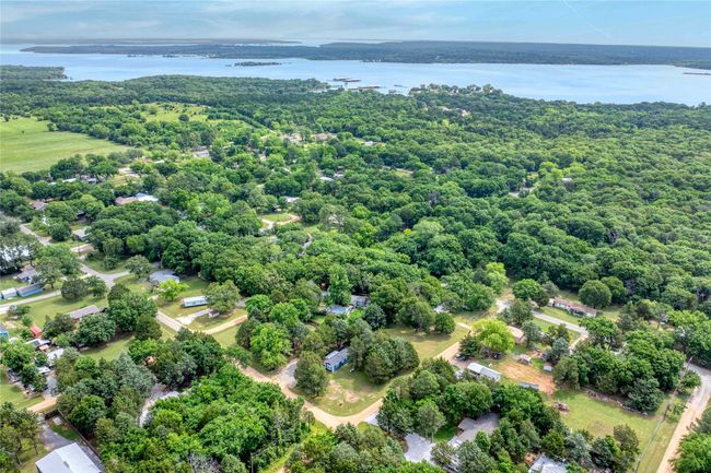 Aerial view of a large body of water and a heavily wooded area | Image 4