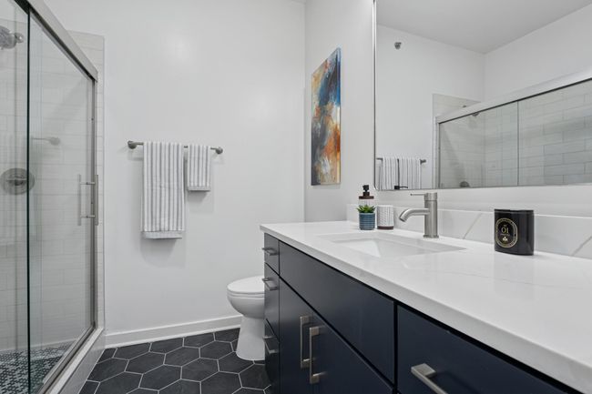 A full bathroom on the upper level keeps things convenient and private for guests or family. | Image 31