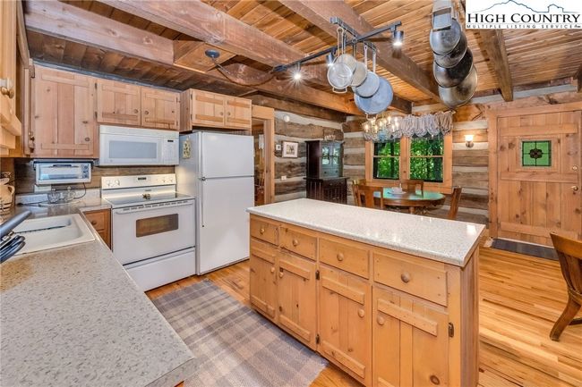 The central island adds prep surface, hidden storage, and a natural hub for friends and family to gather. | Image 8