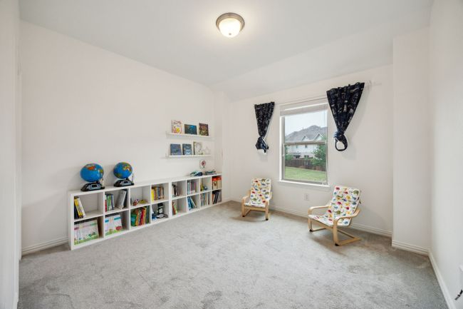 Game room with vaulted ceiling, carpet, and baseboards | Image 20