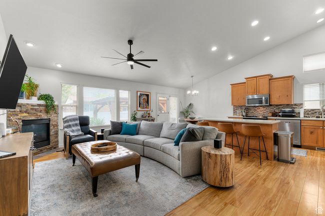 Living area featuring a fireplace, plenty of natural light, and light wood finished floors | Image 4