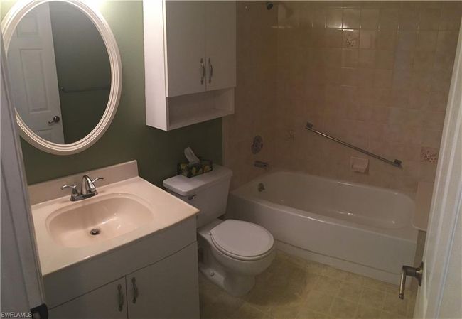 Bathroom with vanity and bathing tub / shower combination | Image 7