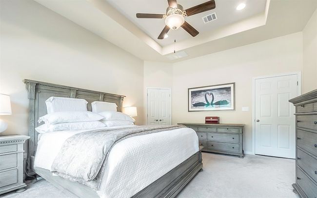 The primary bathroom features two vanities, a walk-in shower, and separate bath tub. There are two separate closets in the primary bathroom as well. | Image 10