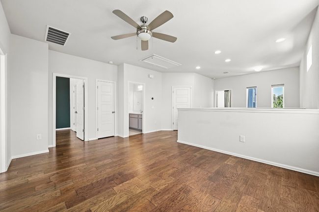 Spare room featuring attic access, ceiling fan, recessed lighting, and dark wood finished floors | Image 18