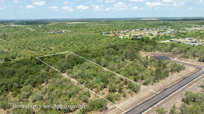 Aerial overview of property's location featuring property boundaries highlighted and a forest | Image 5