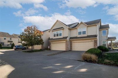 Townhome / multi-family property with a garage | Image 3