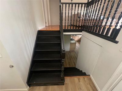 Stairway with hardwood / wood-style floors | Image 3