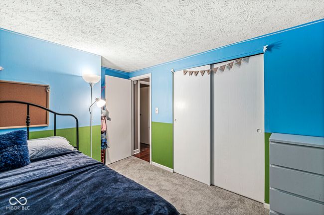bedroom with carpet floors and a closet | Image 16