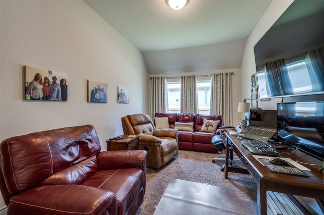 Living area featuring carpet floors, vaulted ceiling, and an office area | Image 15