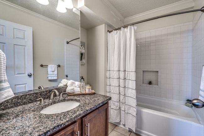 Adjacent to the walk-in closet is your private oasis—the ensuite bath. This spa-like retreat is designed for relaxation and pampering. It features a generous sized combination tub and shower, and elegant vanity with granite countertop! | Image 16