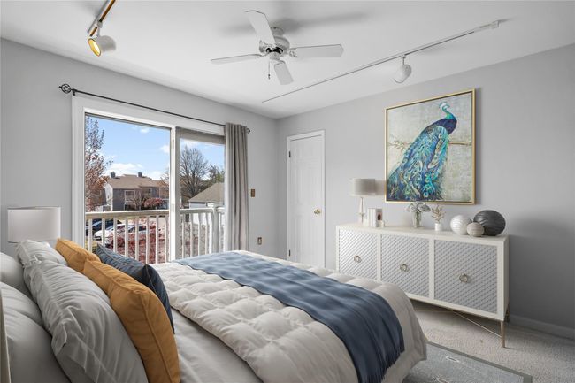 Carpeted bedroom with track lighting, access to exterior, and ceiling fan | Image 9