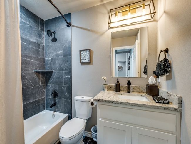 Full bath with vanity, shower / tub combo, and toilet | Image 14
