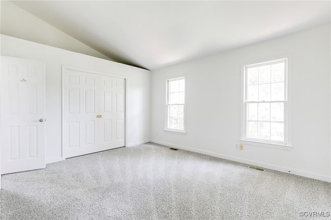 Primary Bedroom 1 with 3 sets of closets. New carpet and paint | Image 24