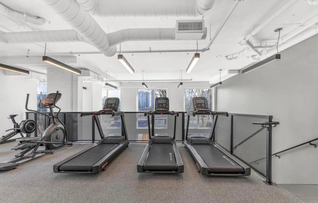 Workout area featuring visible vents | Image 23