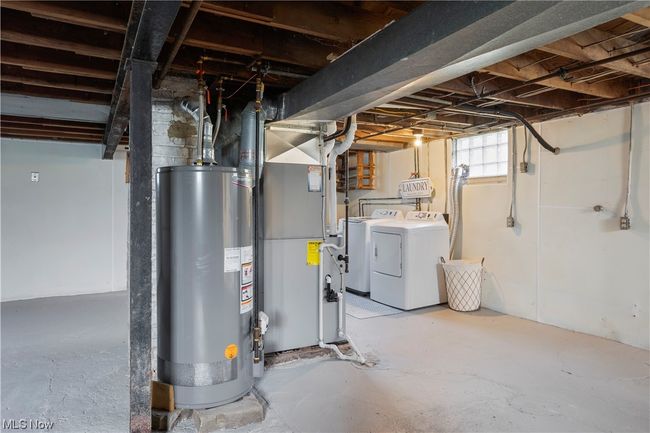 Basement featuring washer and clothes dryer and gas water heater | Image 27