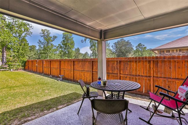 Covered back porch with no adjacent neighbors behind. | Image 4