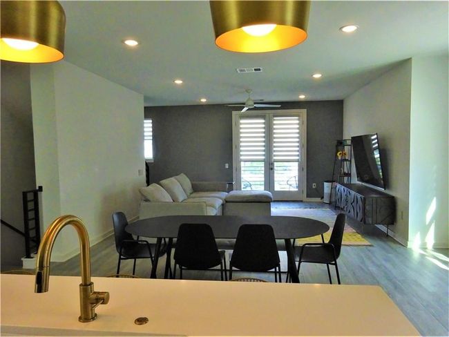 Dining area with plenty of natural light, wood finished floors, recessed lighting, baseboards, and ceiling fan | Image 11