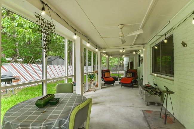Sunroom / solarium featuring ceiling fan | Image 16