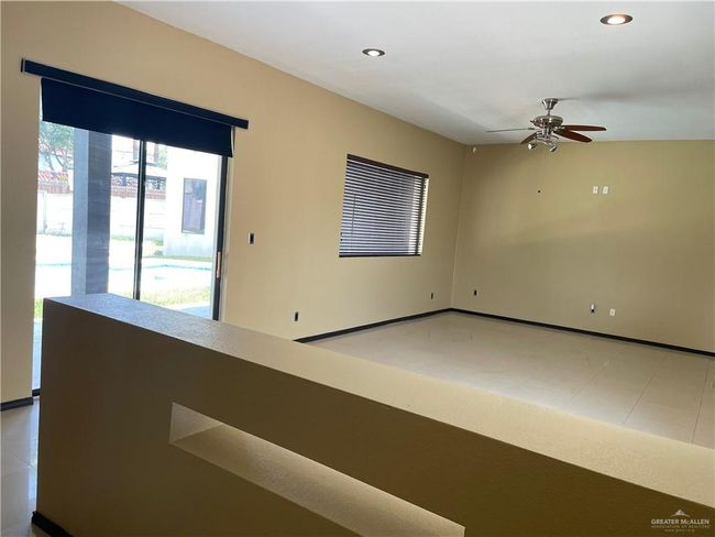 Empty room with ceiling fan, recessed lighting, and baseboards | Image 26