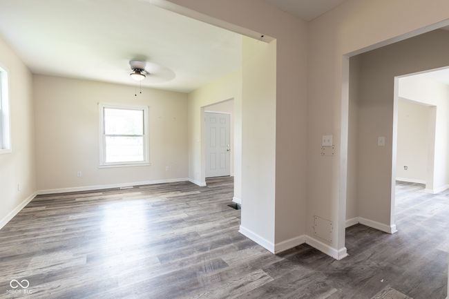 unfurnished room featuring a ceiling fan, baseboards, and wood finished floors | Image 20