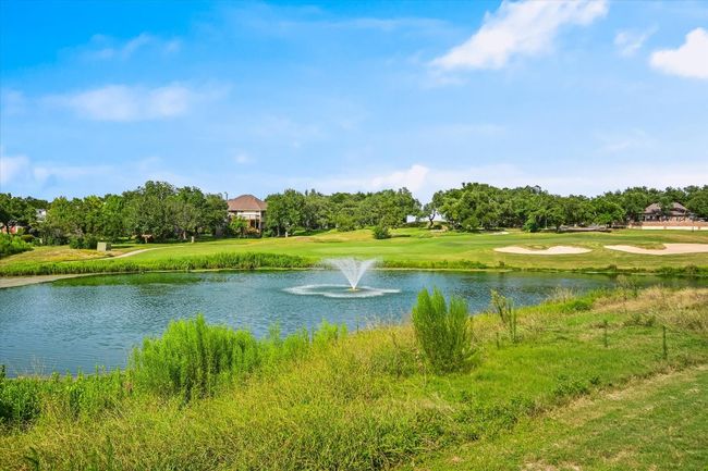 Water view featuring a local golf course and a tree filled landscape | Image 16