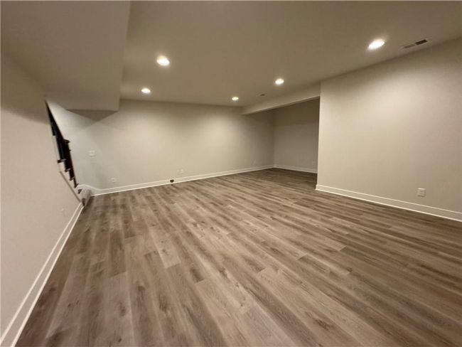 Finished basement featuring recessed lighting and dark wood-type flooring | Image 54