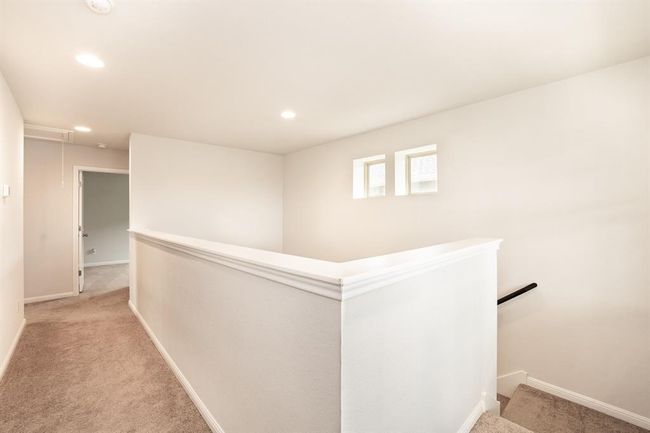 Corridor featuring an upstairs landing, light carpet, and recessed lighting | Image 20