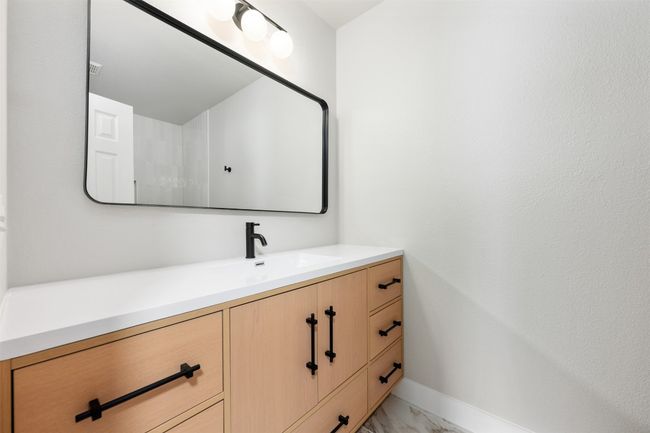Bathroom featuring marble finish floor, baseboards, and vanity | Image 34