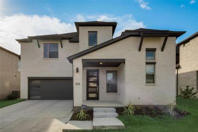 View of front of property with a garage | Image 1