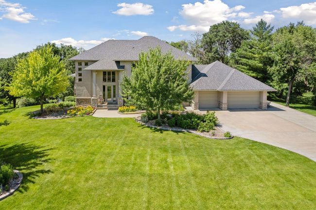 What a setting! Trees, lakeshore is all you need in Minnesota! You will LOVE this private lot and location! Beautiful mature trees and landscaping. Great lake home in the south metro! | Image 59
